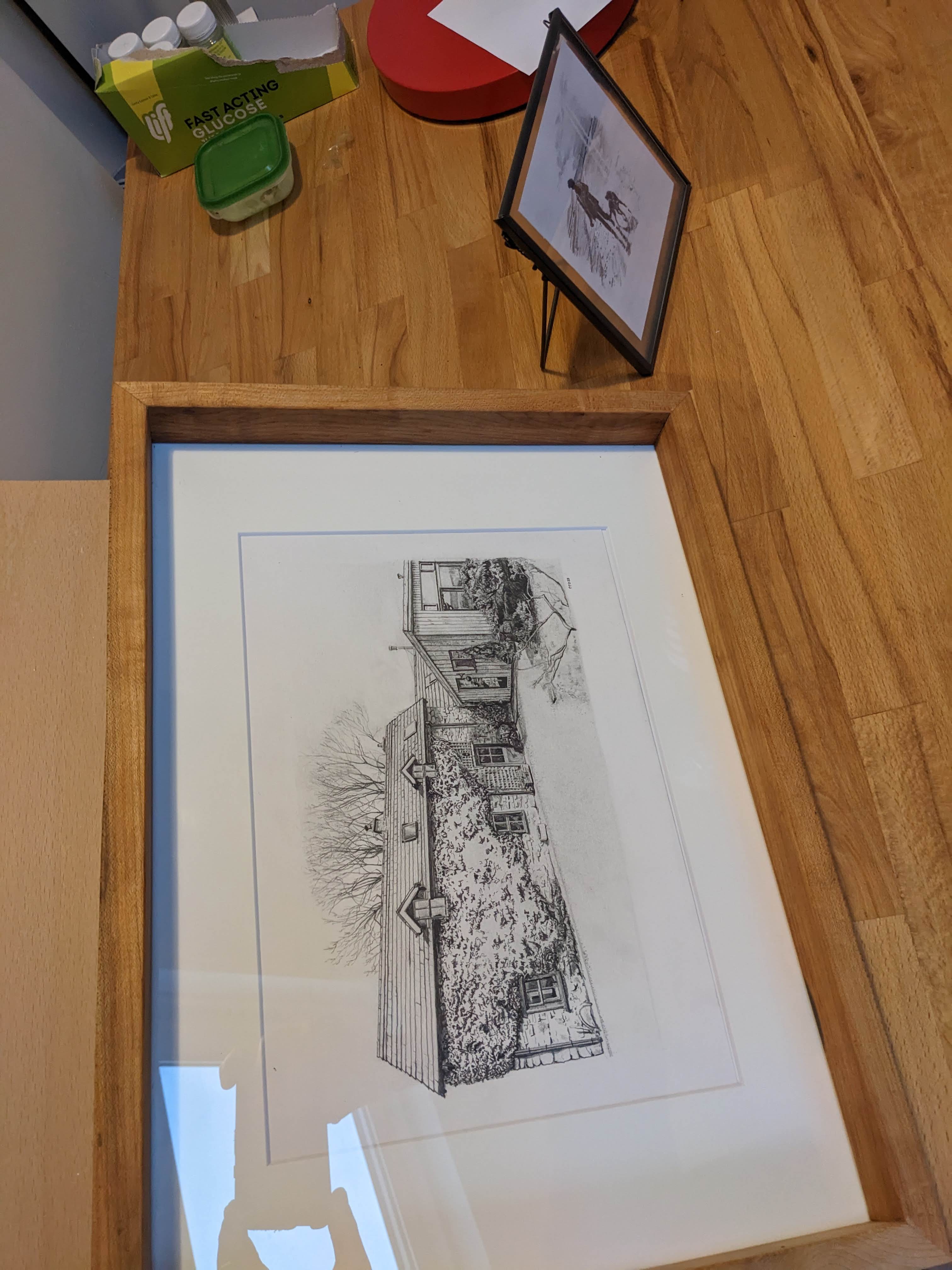 Framed cottage drawing