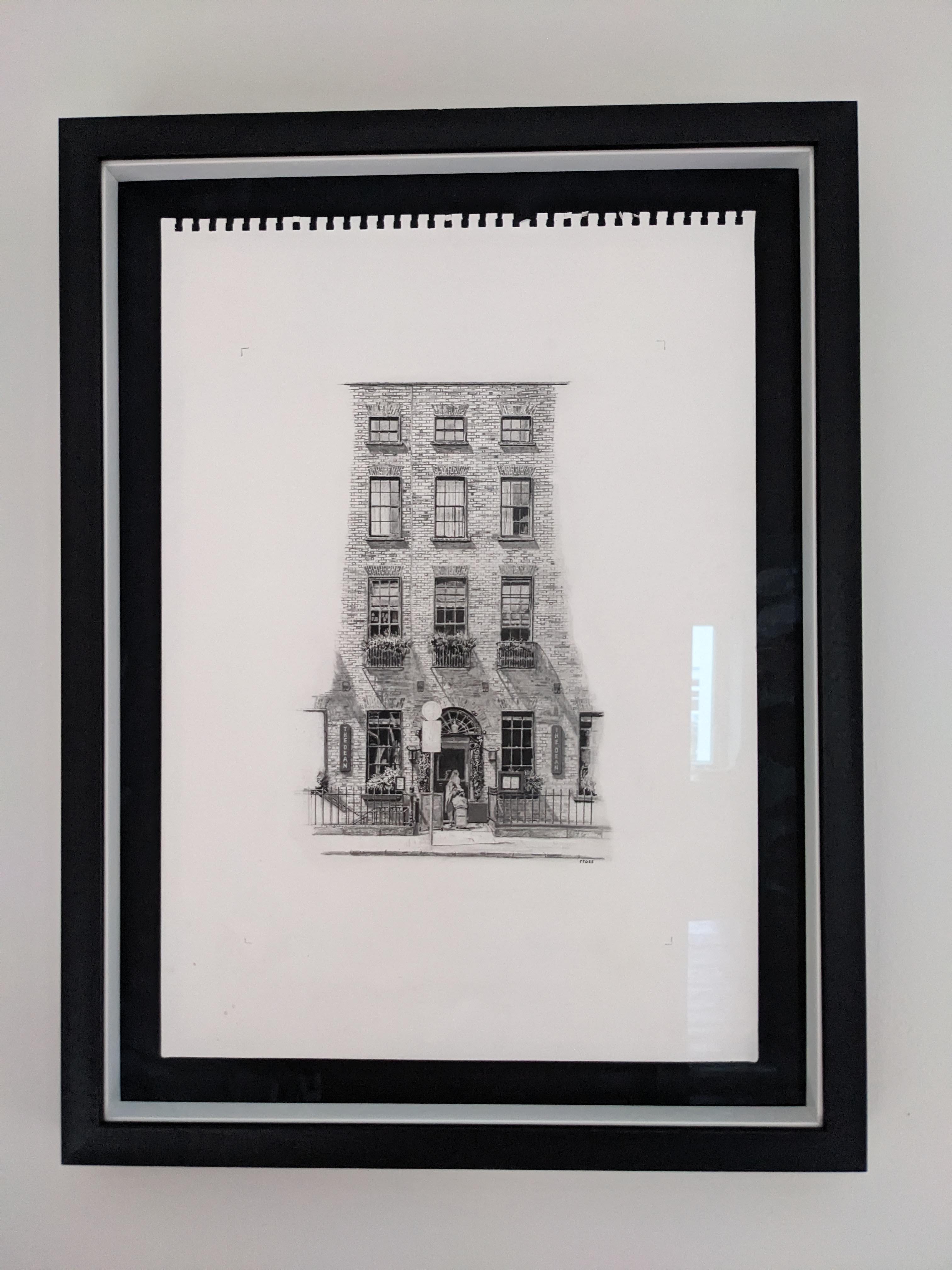 Framed drawing on wall