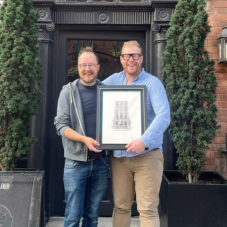 Happy client receiving the drawing